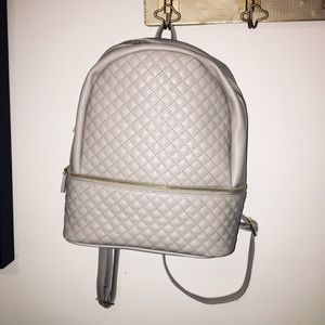 Gray leather backpack w/ gold zipper